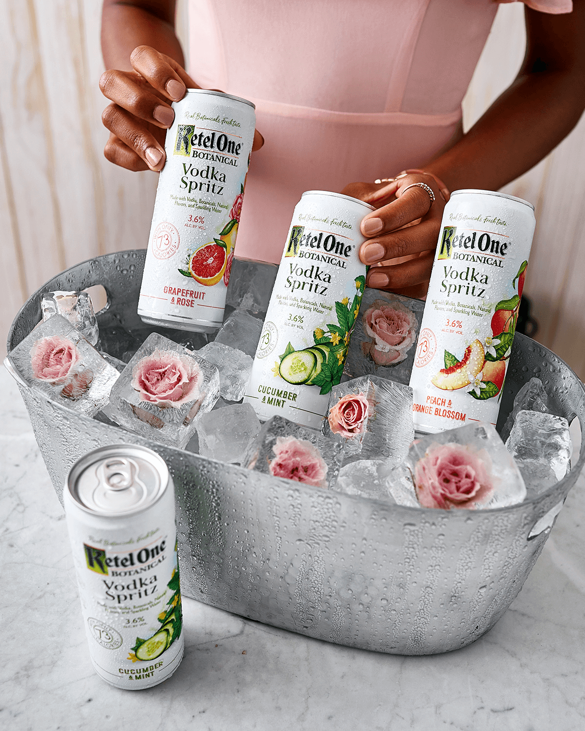 Botanical vodka spritz cans displayed in an ice bucket