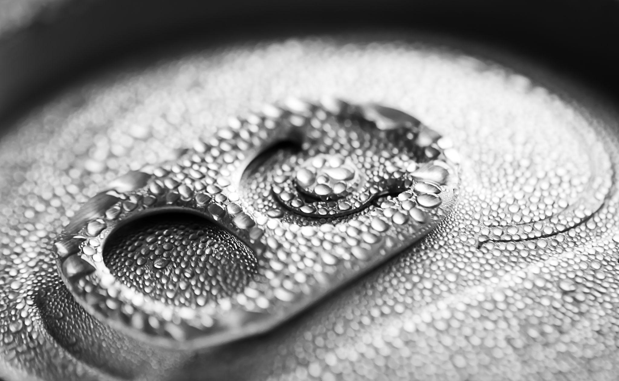 Close view of condensation on a canned beverage surface